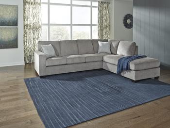 Ashley Furniture Altari sectional with chaise, beige fabric sofa with plush cushions and modern design in a bright living room setting.