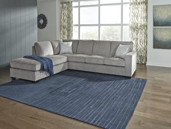 Ashley Furniture Altari sleeper sectional with chaise, showing plush fabric, modern design, and spacious seating in a living room setting.