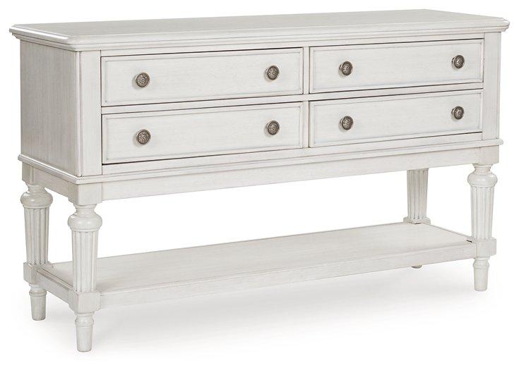 Montelaine dining server by Ashley Furniture with a wooden finish, featuring multiple storage drawers and elegant design.