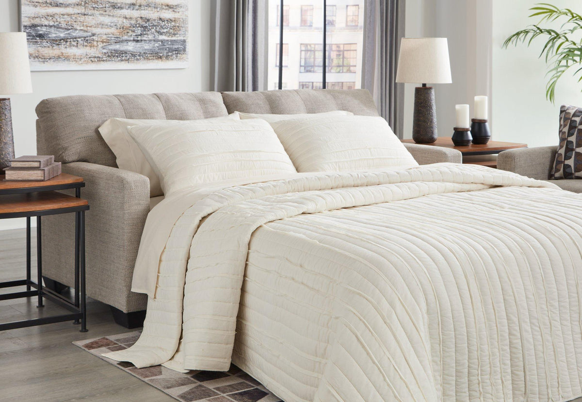 Ashley Furniture Mahoney sofa sleeper with plush fabric, featuring a modern design and a pull-out bed for versatile sitting and sleeping space.