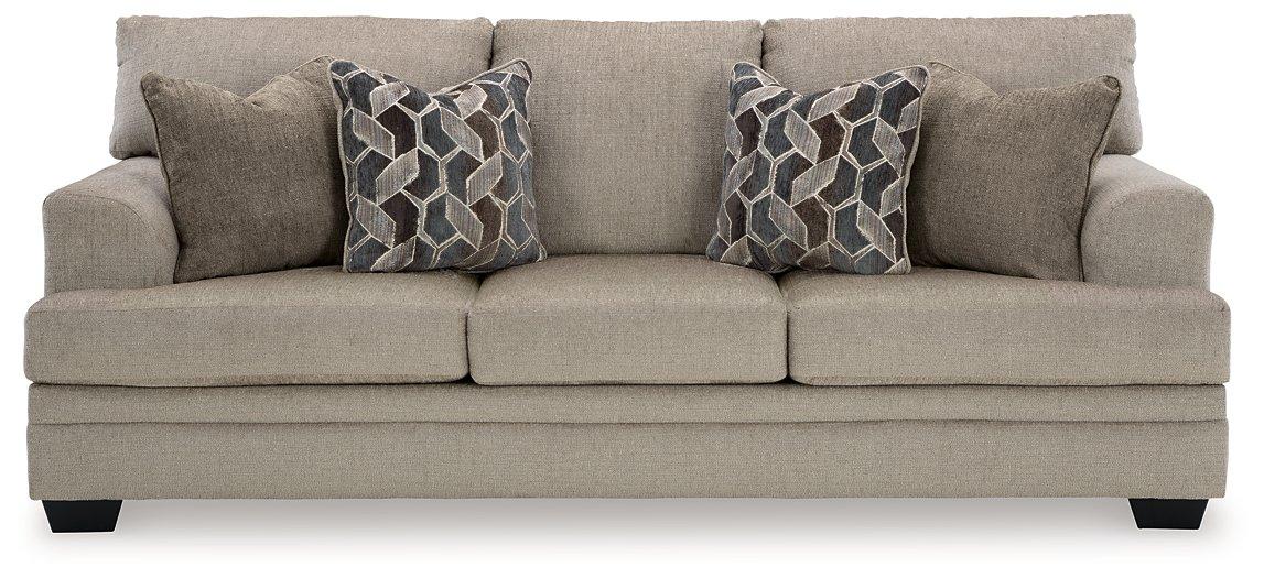 Ashley Furniture Stonemeade sofa sleeper with plush fabric, showing the open bed and cushioned seating in a modern living room setting.