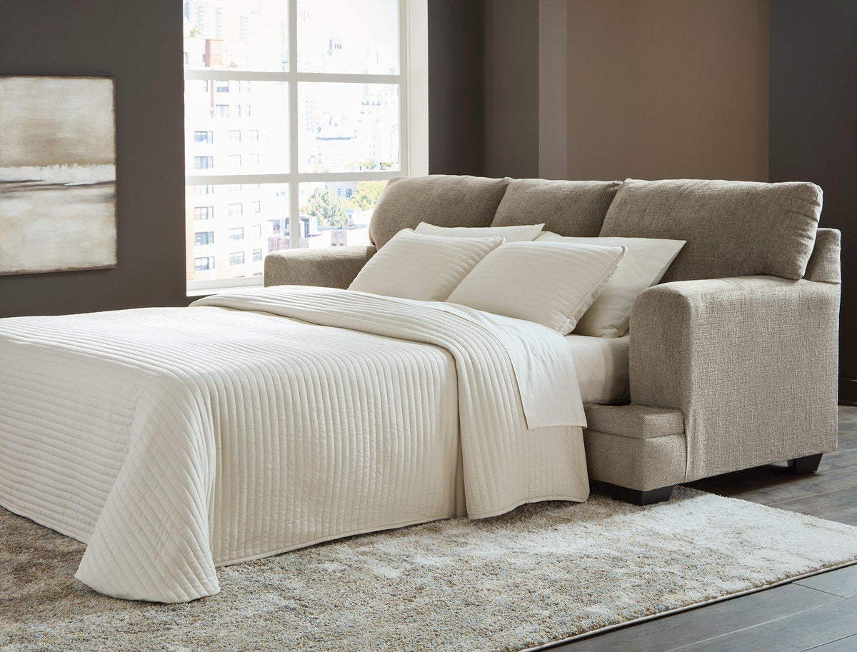 Ashley Furniture Stonemeade sofa sleeper with plush cushions and convertible design, shown in a modern living room setting.