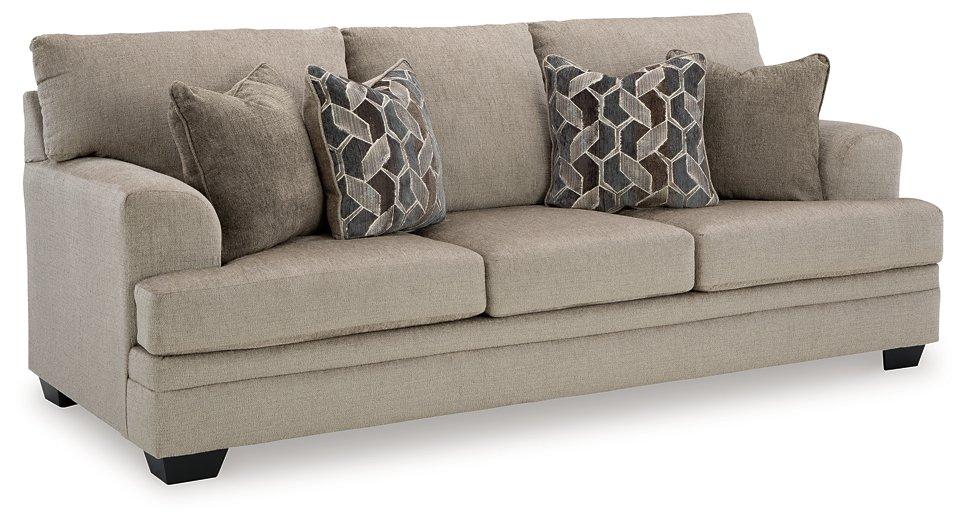 Ashley Furniture Stonemeade sofa sleeper showing a modern fabric sofa with a pulled-out bed in a living room setting.