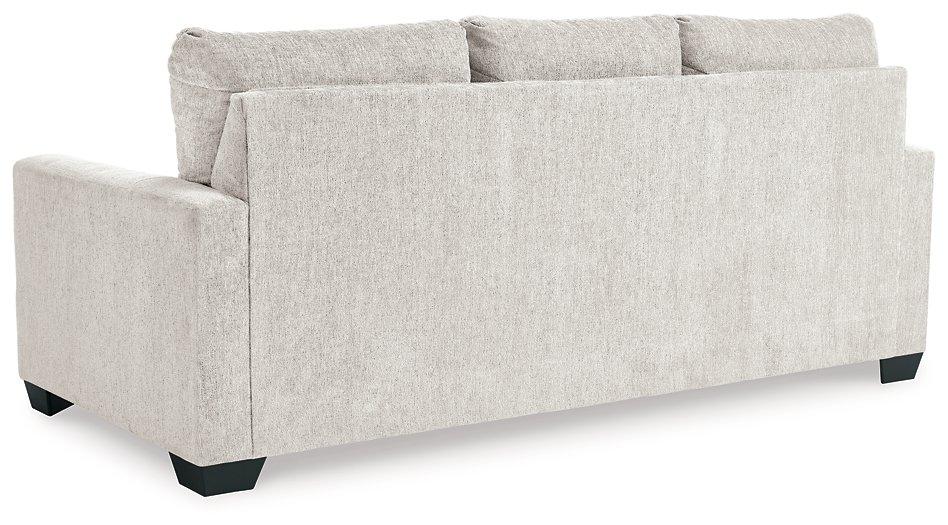 Ashley Furniture Rannis sofa sleeper with plush fabric, featuring a stylish design and fold-out bed for versatile seating and sleeping space.