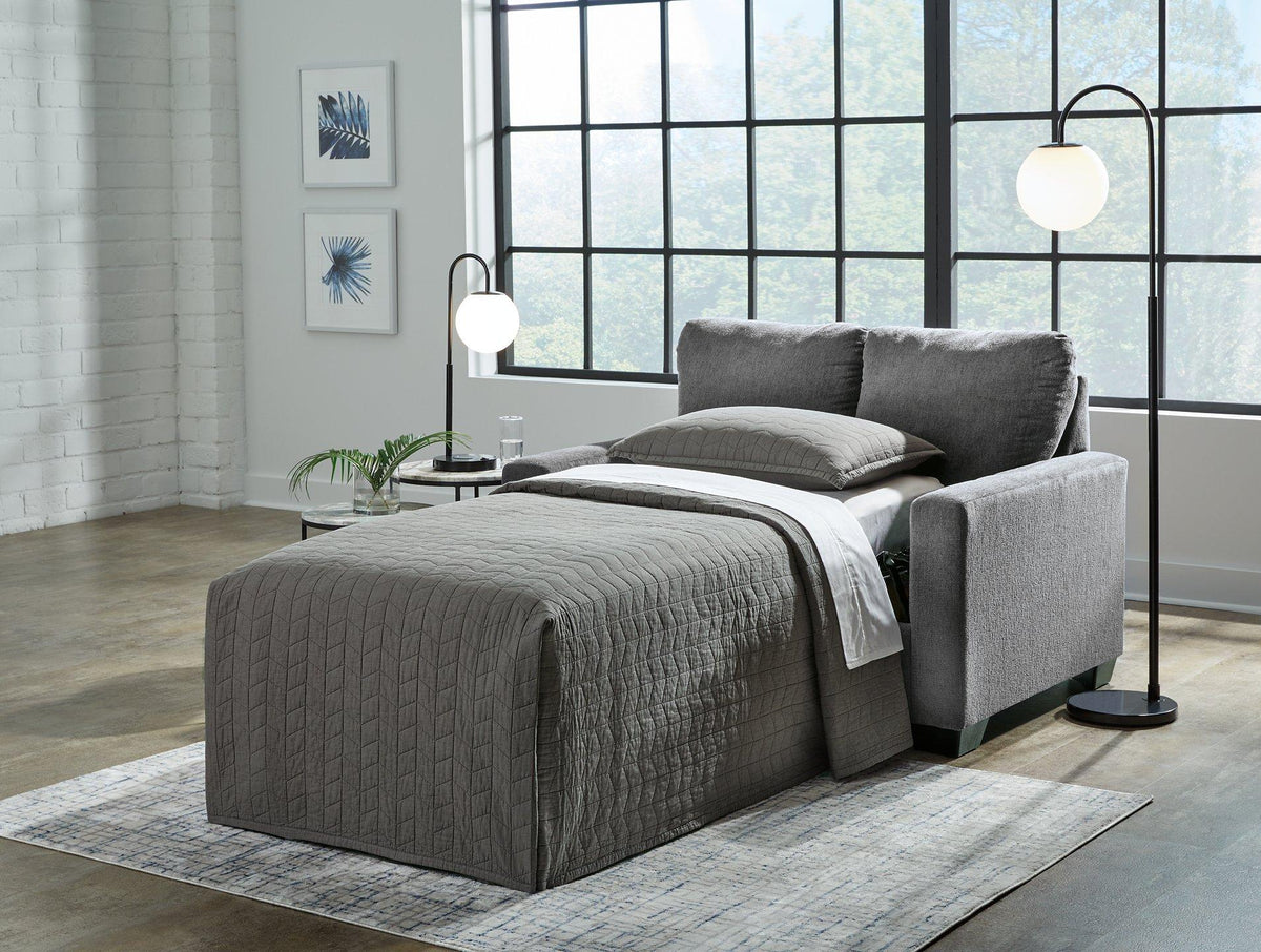 Ashley Furniture Rannis sofa sleeper with plush fabric, featuring a modern design and fold-out bed for versatile living space.