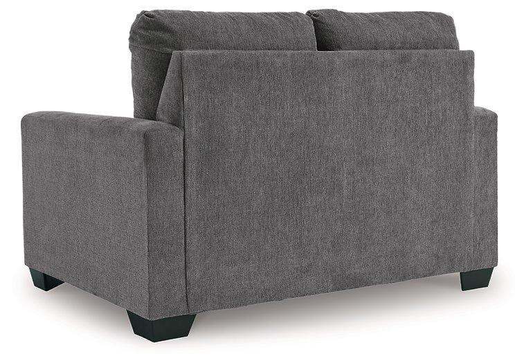 Ashley Furniture Rannis Sofa Sleeper with plush fabric, featuring a compact design and fold-out bed for versatile living space.