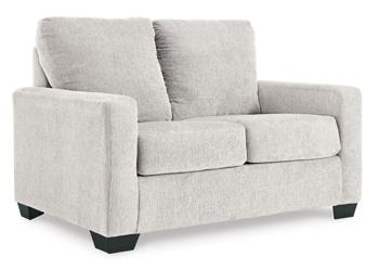 Ashley Furniture Rannis sofa sleeper with plush fabric and convertible design, ideal for comfortable lounging and sleeping.