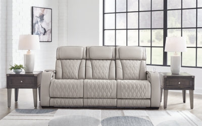 Ashley Furniture Boyington Power Reclining Sofa with plush cushions and dark upholstery, designed for comfort and style.