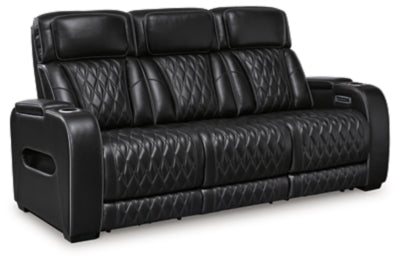 Ashley Furniture Boyington Power Reclining Sofa, shown from an angled view with closed recliners and dark upholstery.