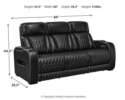 Ashley Furniture Boyington Power Reclining Sofa with plush cushions and dark upholstery, showcasing its modern design and reclining features.