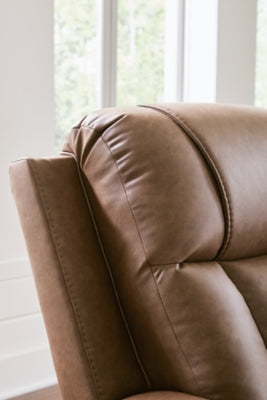 Ashley Furniture Mackmenville reclining sofa showing plush fabric, padded armrests, and built-in reclining features.