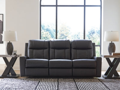 Ashley Furniture Mackmenville reclining sofa with plush cushions and fabric upholstery, shown in a closed reclining position.