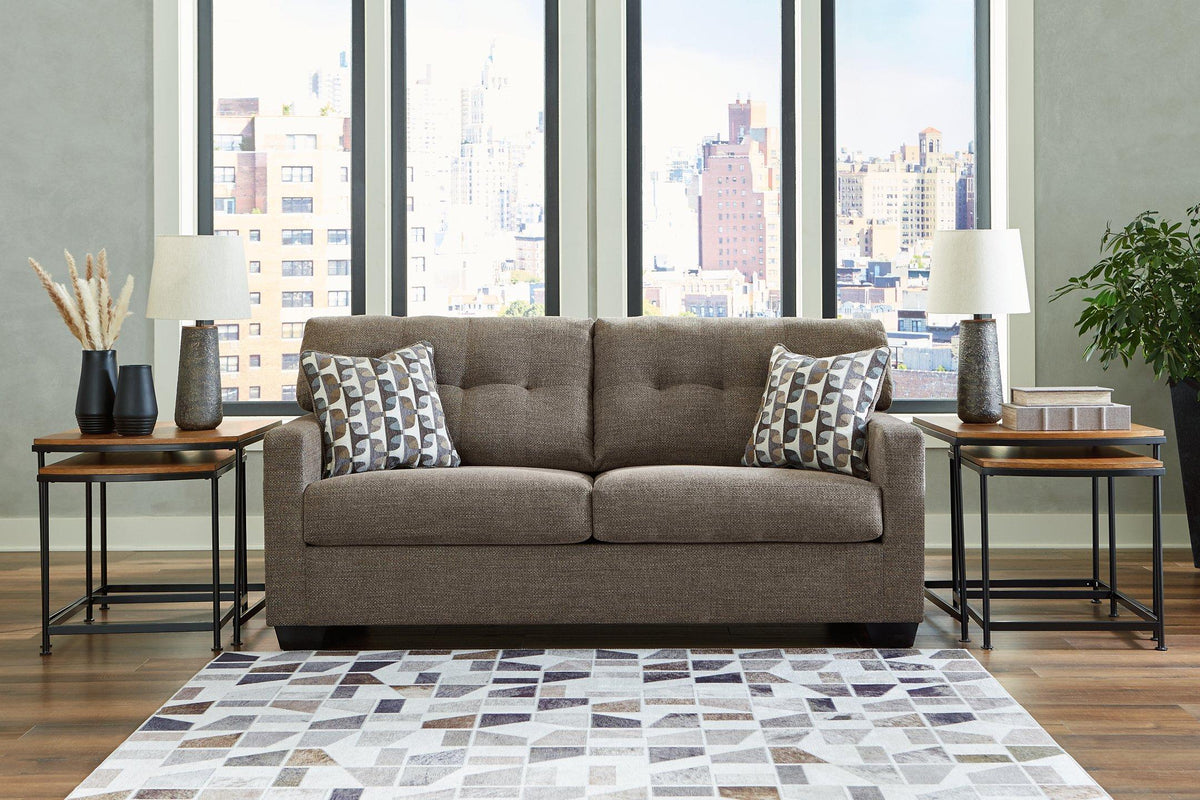 Ashley Furniture Mahoney sofa with plush cushions and neutral fabric, showcasing a modern living room setup.
