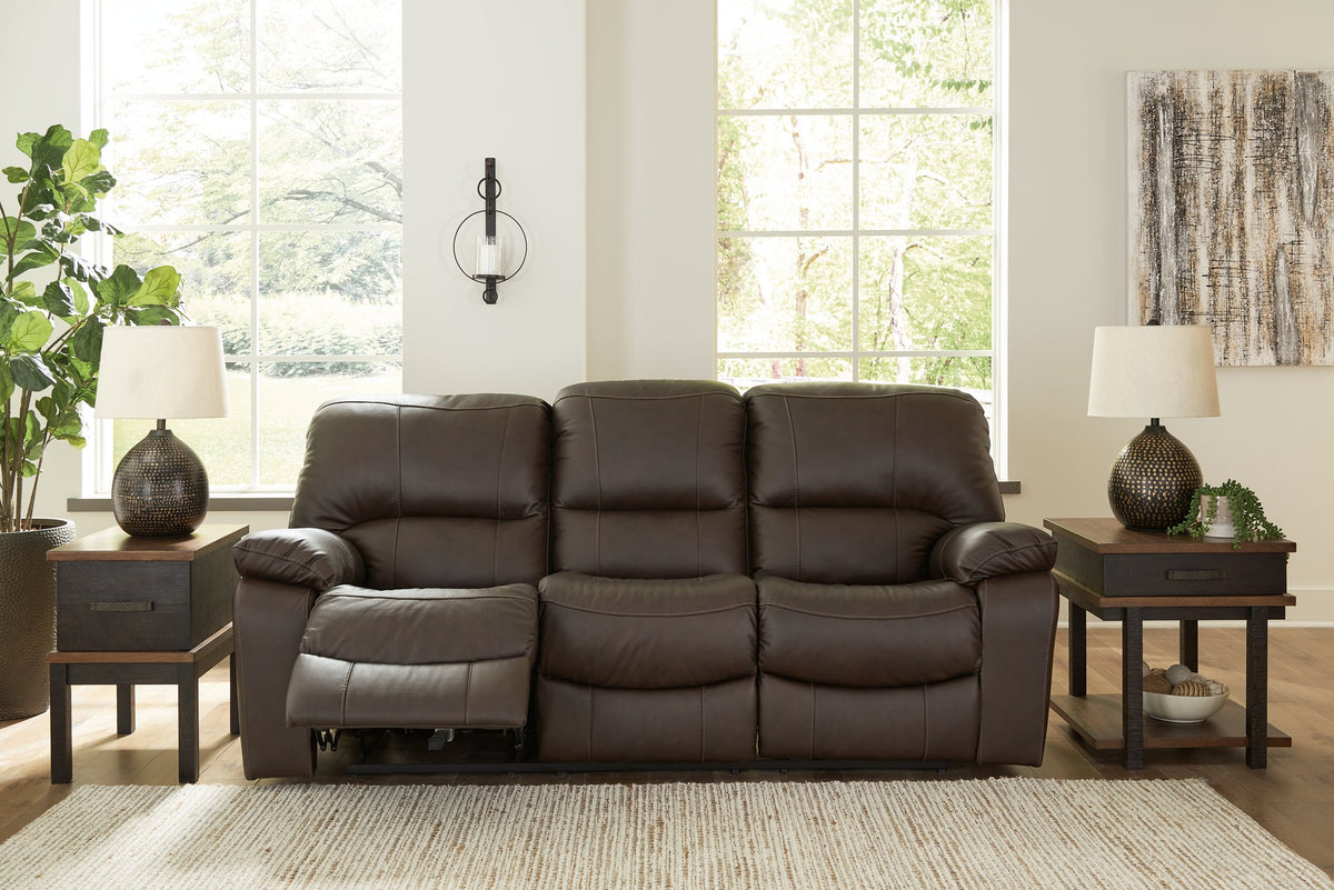 Ashley Furniture Leesworth power reclining sofa with plush cushions and dark leather upholstery, shown from a front angle.