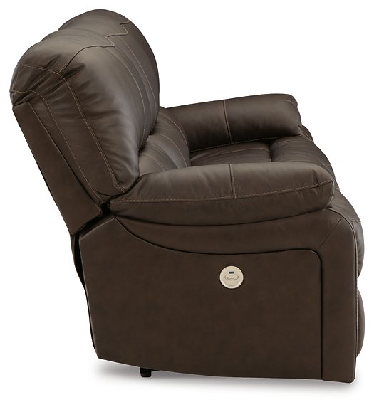 Ashley Furniture Leesworth Power Reclining Sofa with plush fabric and padded armrests, shown from the side in a modern living room setting.