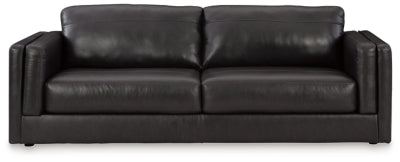 Ashley Furniture Amiata sofa with plush cushions and neutral upholstery, shown from a front head-on angle.