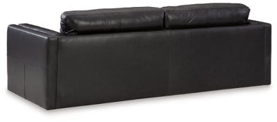 Ashley Furniture Amiata sofa with plush back cushions and contemporary design, shown from the rear view.