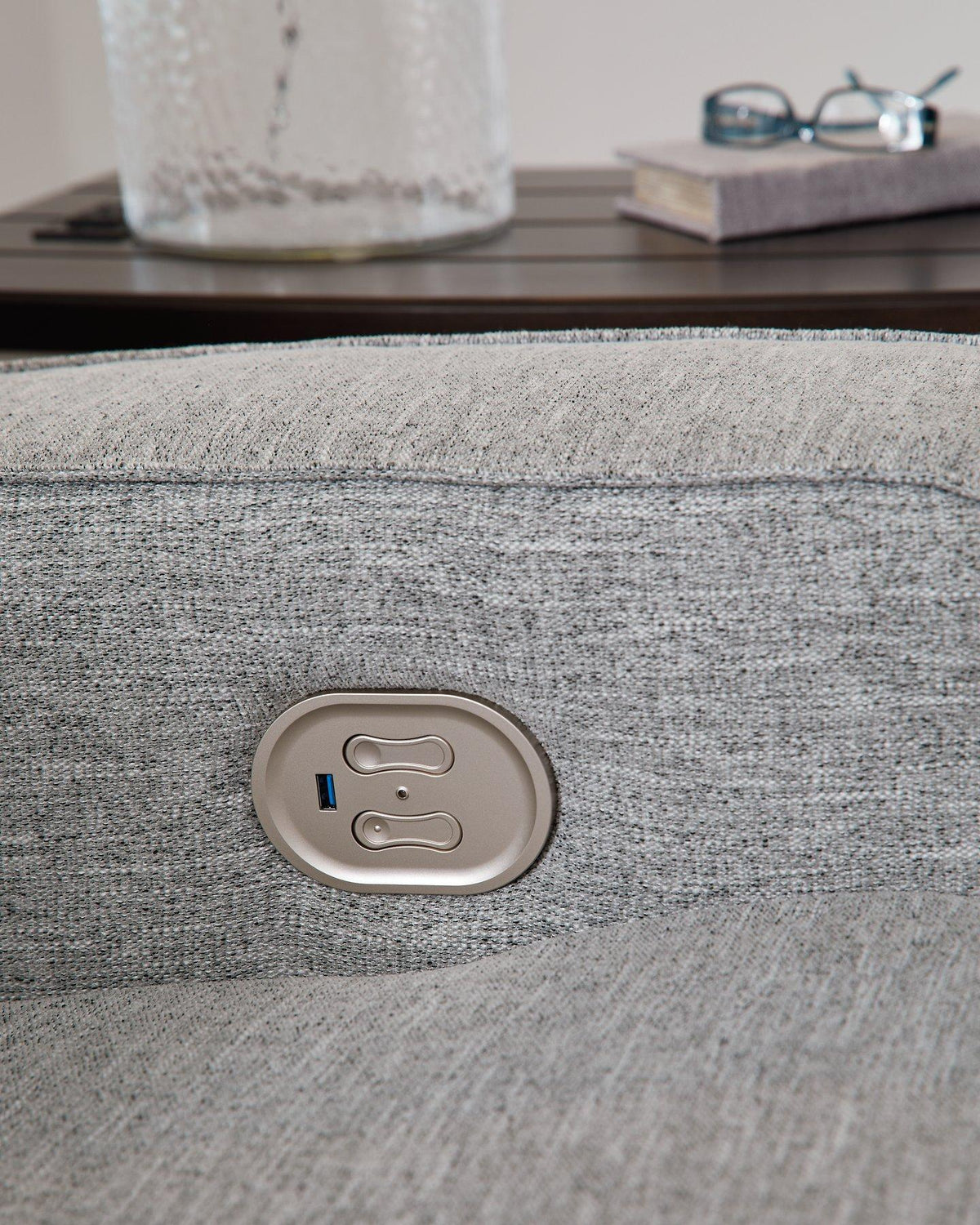 Ashley Furniture Biscoe Power Reclining Sofa with plush fabric and built-in recline mechanism, showcasing its comfortable seating and modern design.