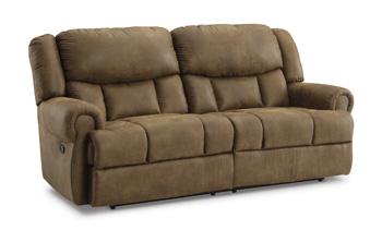 Ashley Furniture Boothbay reclining sofa with plush cushions and wide armrests, shown in a cozy living room setting.