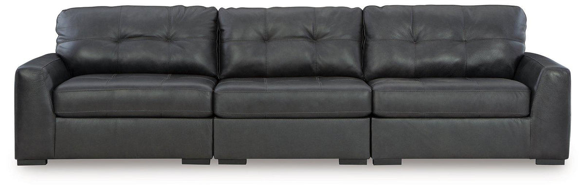 Ashley Furniture Brindley sectional sofa with plush cushions and modern design, shown in a cozy living room setting.