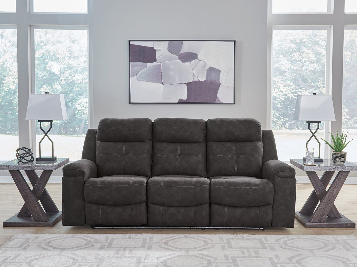Ashley Furniture Brysonview reclining sofa with plush cushions and fabric upholstery, shown in an image with LED lights off.