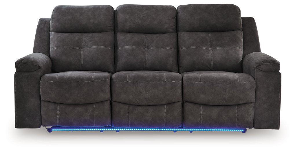 Ashley Furniture Brysonview reclining sofa in blue with plush cushions and reclining features, shown head-on view.