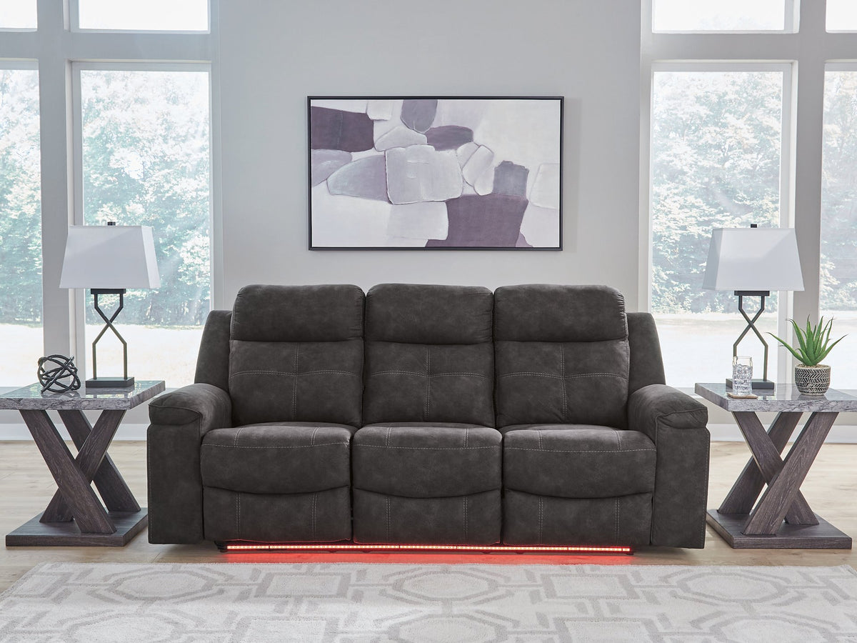 Ashley Furniture Brysonview reclining sofa in red fabric with plush cushions and a modern design, perfect for living room seating.