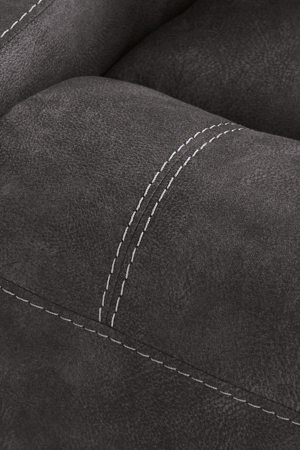 Close-up of Ashley Furniture Brysonview reclining sofa showing detailed stitching and plush fabric upholstery.