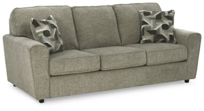 Ashley Furniture Cascilla sofa shown from an angle, featuring plush cushions and stylish fabric upholstery.