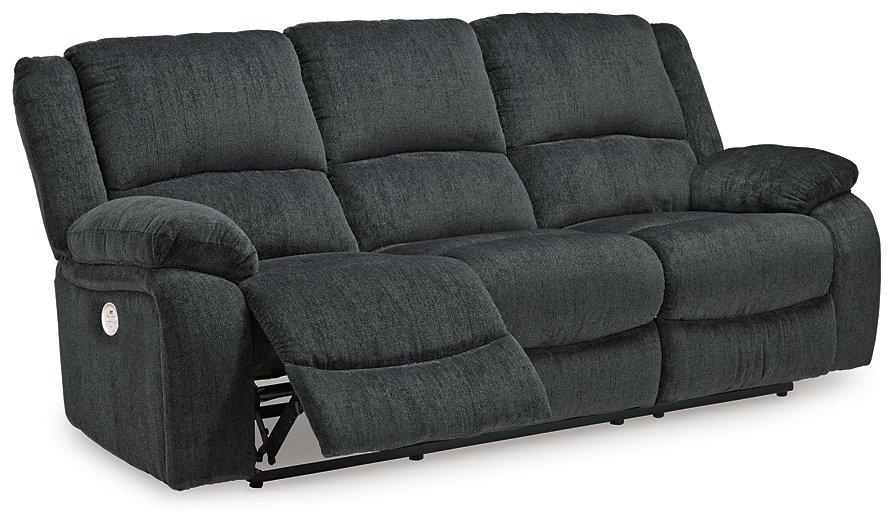 Ashley Furniture Draycoll power reclining sofa with plush fabric and padded armrests, perfect for relaxing living room seating.