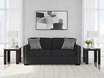 Ashley Furniture Jasmine Peaks sofa with plush upholstery and stylish design, shown in a cozy living room setting.