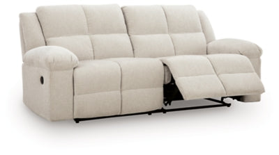 Ashley Furniture Orlen reclining sofa shown from an angled open view, featuring plush cushions and reclining mechanisms.