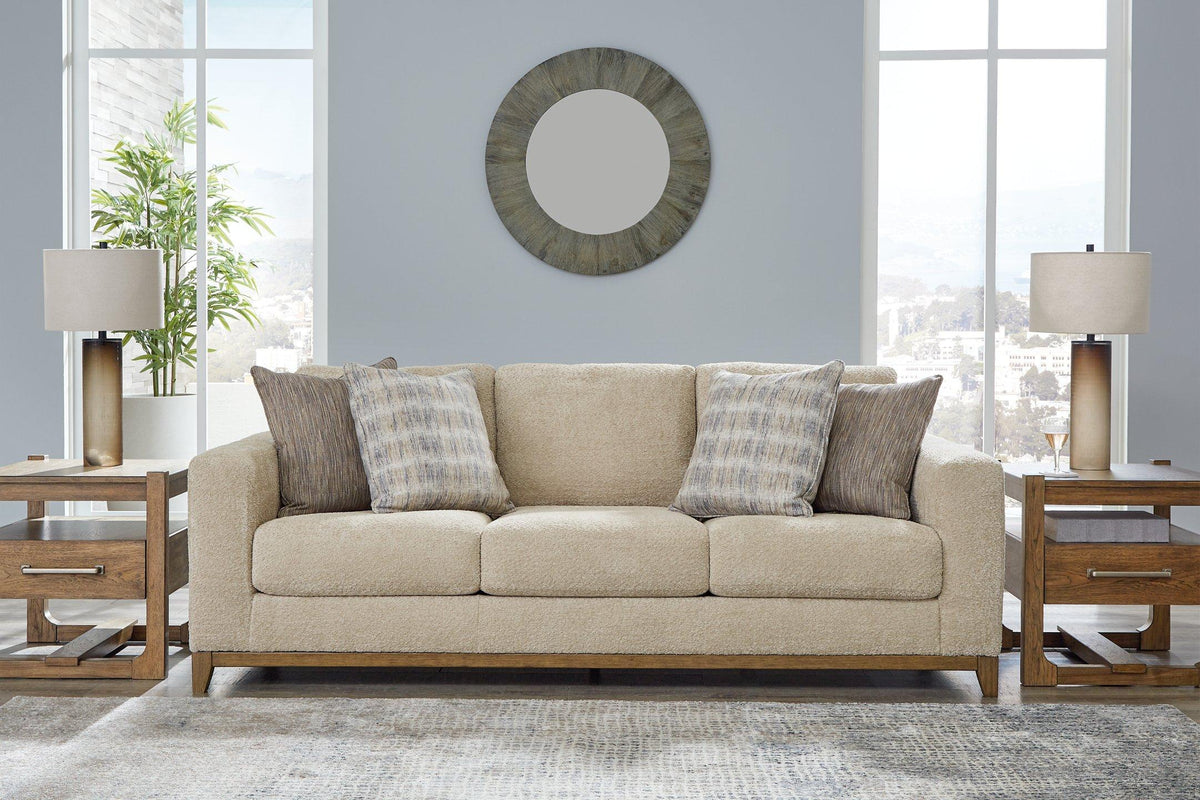 Ashley Furniture Parklynn sofa with plush cushions and sleek fabric upholstery in a modern living room setting.