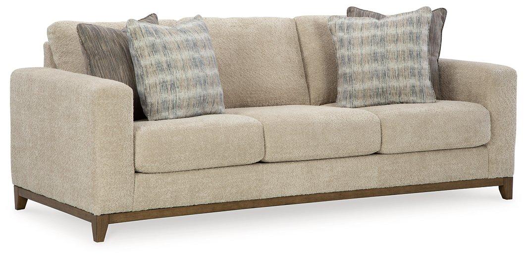 Ashley Furniture Parklynn Sofa showing a stylish, plush fabric upholstery with a contemporary design in a well-lit living room setting.