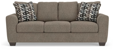 Ashley Furniture Triston-Peaks sofa with plush cushions and neutral fabric, shown from a front head-on angle.
