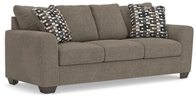 Ashley Furniture Triston Peaks sofa shown from an angled view, featuring plush cushions and stylish upholstery.
