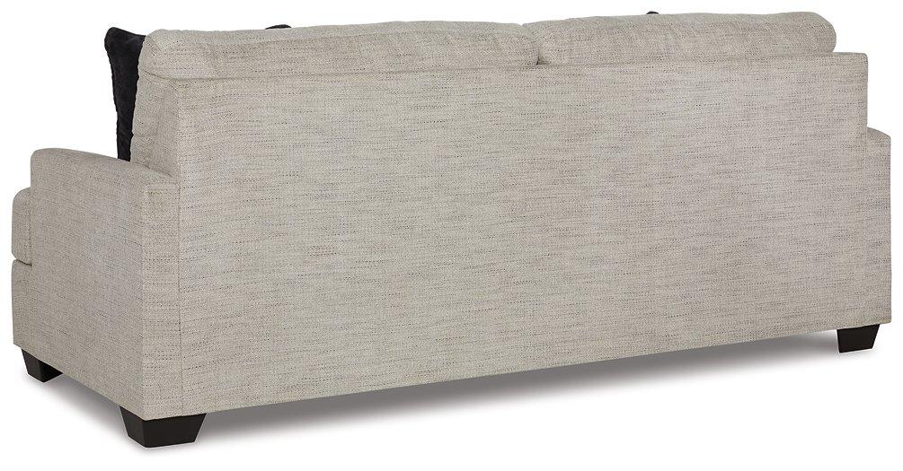Ashley Furniture Vayda Sofa with plush fabric, modern design, and comfortable cushions displayed in a stylish living room setting.