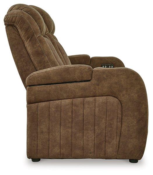 Ashley Furniture Wolfridge power reclining sofa with plush cushions and dark upholstery, showcasing its comfortable, modern design.