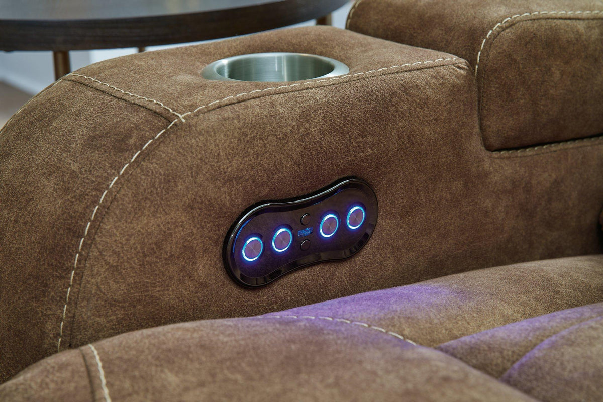 Ashley Furniture Wolfridge power reclining sofa showing plush fabric, multiple reclining seats, and modern design.
