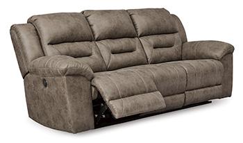 Ashley Furniture Stoneland Power Reclining Sofa with plush cushions and modern design, shown in a cozy living room setting.