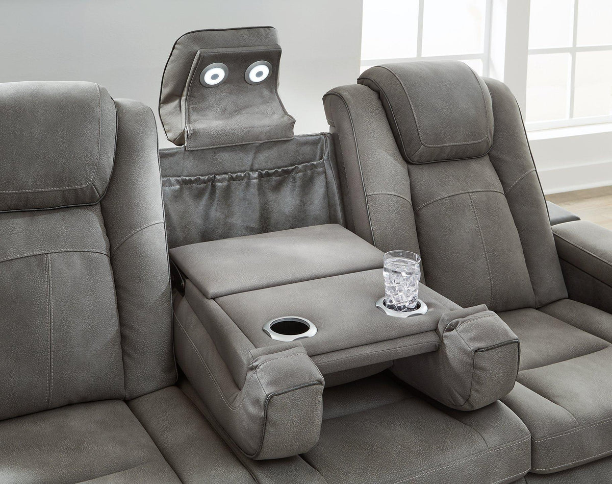 Ashley Furniture Next-Gen DuraPella Power Reclining Sofa with plush fabric and built-in recline controls, shown in a modern living room setting.