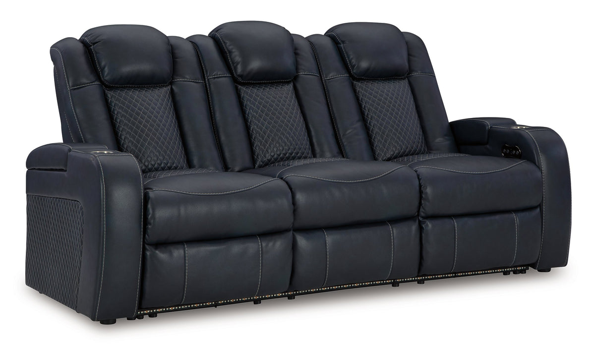 Ashley Furniture Fyne-Dyme Power Reclining Sofa shown from an angled view, featuring plush cushions and a sleek reclining design.