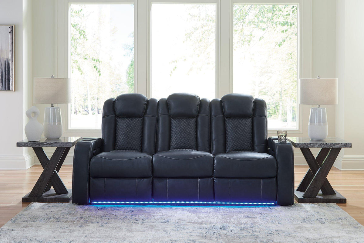 Fyne-Dyme Power Reclining Sofa by Ashley Furniture, featuring plush cushions and a modern design in a neutral fabric.