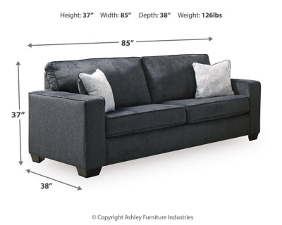 Ashley Furniture Altari sofa with plush fabric, wide armrests, and stylish design in a cozy living room setting.