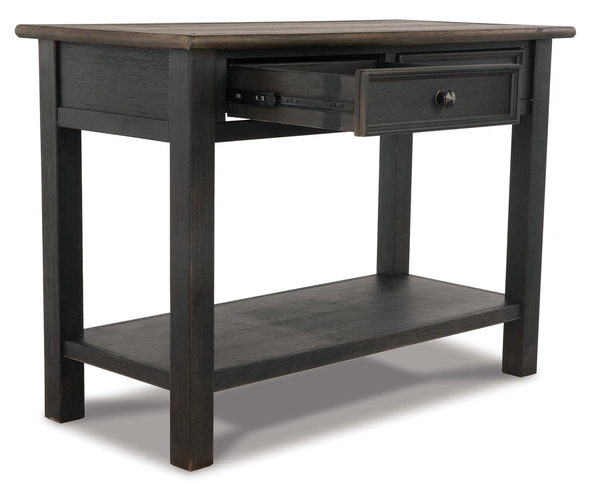 Ashley Furniture Tyler Creek sofa table with wood finish, featuring a sleek console design and spacious surface for living room decor.