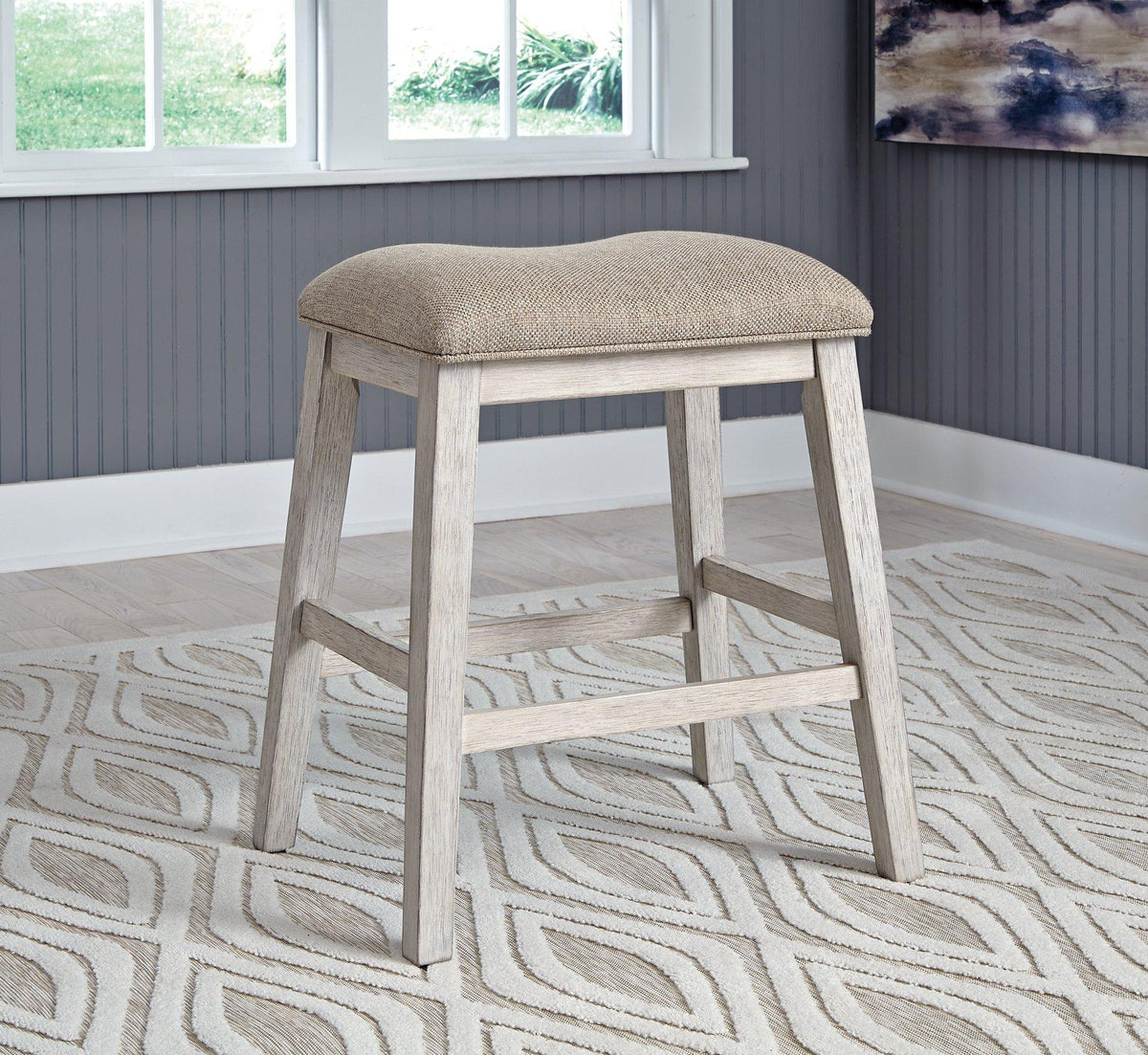 Ashley Furniture Skempton counter height bar stool with wooden legs and upholstered seat, ideal for kitchen or bar area.