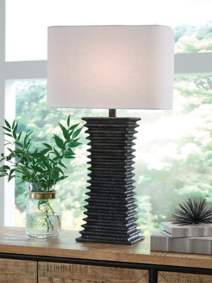 Ashley Furniture Golzar table lamp with a sleek design and fabric shade, perfect for living room or bedside decor.