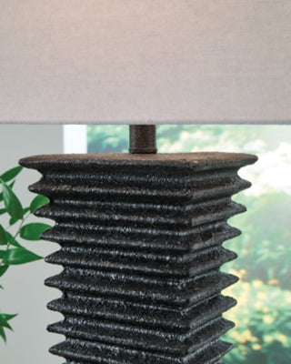Ashley Furniture Golzar table lamp with a stylish design and fabric shade, perfect for enhancing living room or bedside decor.