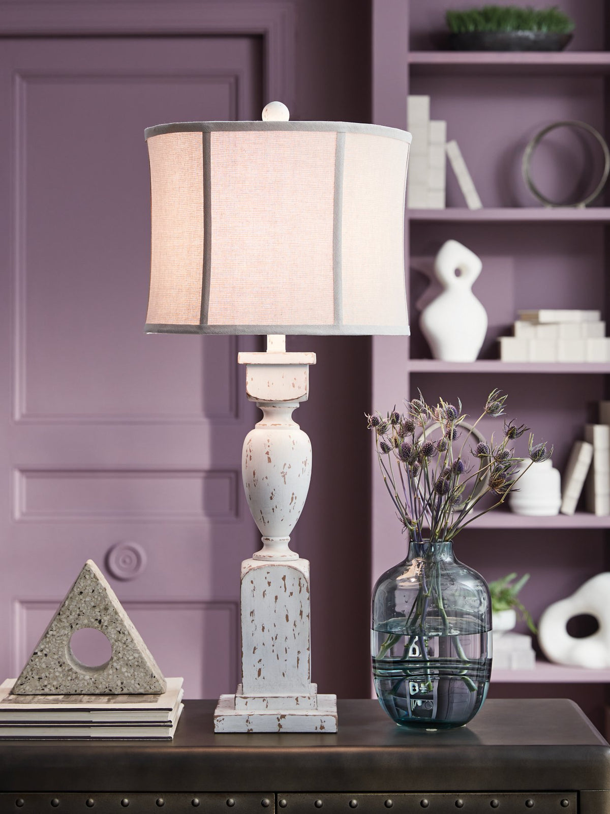 Ashley Furniture Madsbrook table lamp with a sleek base and fabric shade, ideal for living room or bedside lighting.