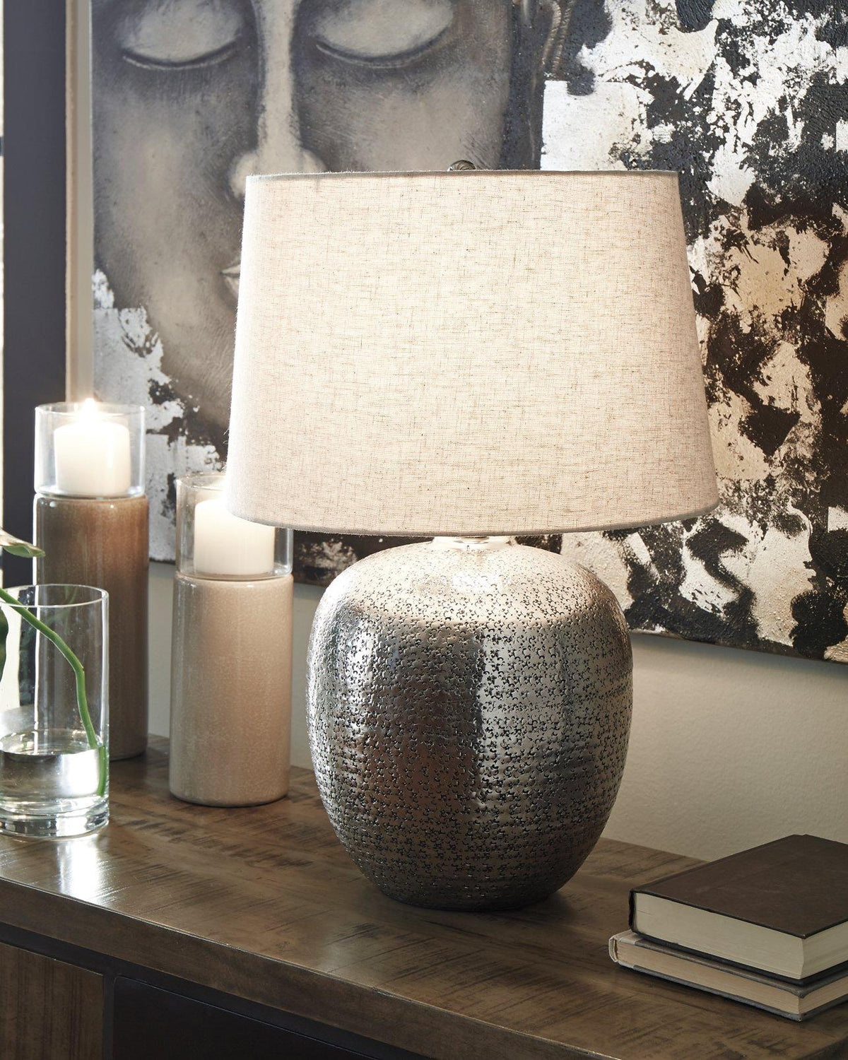 Ashley Furniture Magalie table lamp with a sleek base and fabric shade, ideal for elegant home lighting.